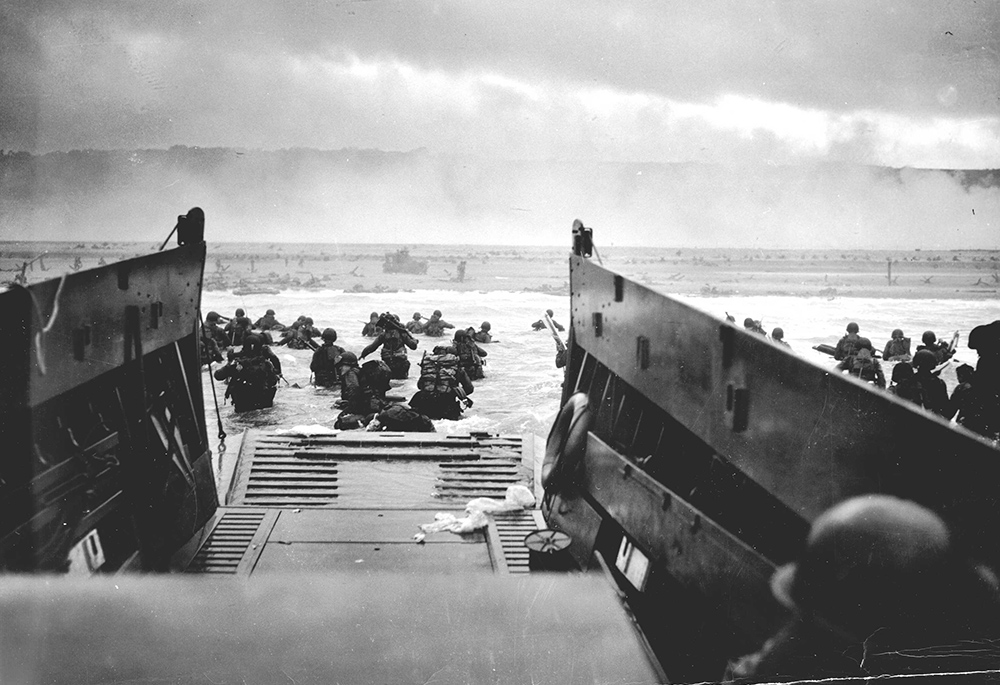 A LCVP (Landing Craft, Vehicle, Personnel) from the U.S. Coast Guard-manned USS Samuel Chase disembarks troops of the U.S. Army's First Division on the morning of June 6, 1944, (D-Day) at Omaha Beach. (Wikimedia Commons/U.S. Coast Guard/Chief Photographer's Mate (CPHOM) Robert F. Sargent)