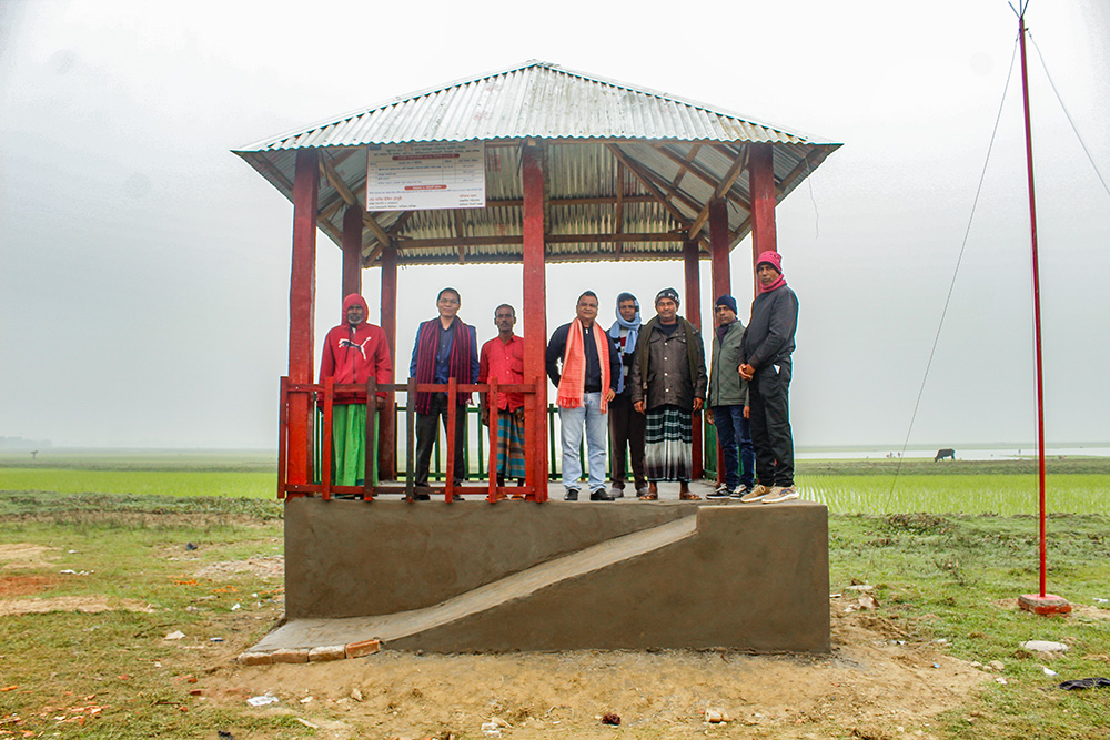 Boniface Khonglah (fourth from left), the regional director of Caritas Sylhet Region, alongside other local leaders, visits the lightning protection shelter at Panchauniya Haor in the Baniachang subdistrict of Habiganj district, Bangladesh, Jan. 17. (Courtesy of Caritas Bangladesh)
