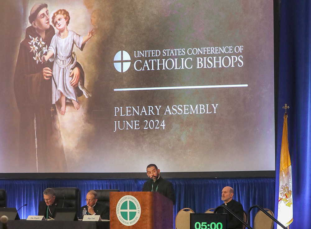 Bishop Daniel Flores of Brownsville, Texas, speaks June 13 at the U.S. Conference of Catholic Bishops' Spring Plenary Assembly in Louisville, Kentucky. (OSV News/Bob Roller)