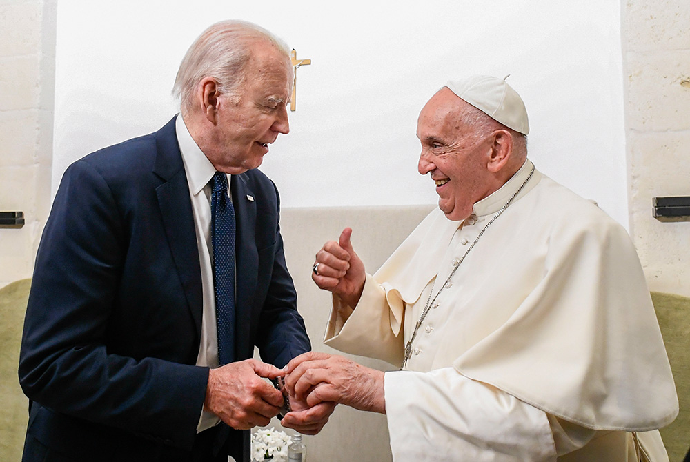 Pope Francis gives U.S. President Joe Biden a thumbs-up during a private meeting on the margins of the G7 summit in Borgo Egnazia, in Italy's southern Puglia region, June 14. (CNS/Vatican Media)