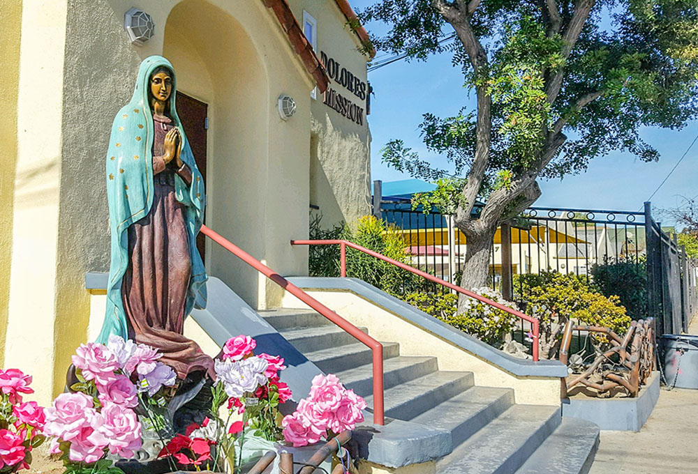 A statue of Our Lady of Guadalupe is seen outside of Dolores Mission Church in Los Angeles. (NCR photo/Dan Morris-Young)