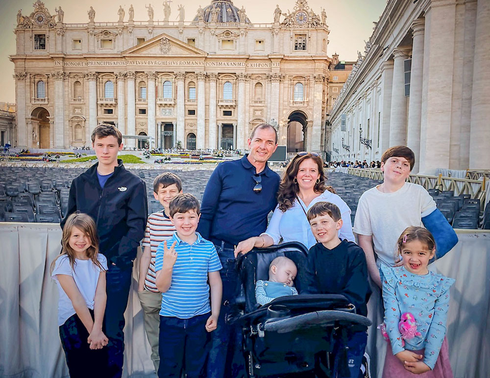 Melinda Ribnek poses with her family in St. Peter's Square at the Vatican in April. "I think the Holy Spirit consistently moves through the church," said Ribnek. "And we are in a period where the Holy Spirit is speaking from these marginalized communities, and also to the church, and in time I have hope that we'll come to an understanding that respects both the heart of the church's teachings but with a deep and understanding of the hardest things in context of these issues." (Courtesy of Melinda Ribnek)