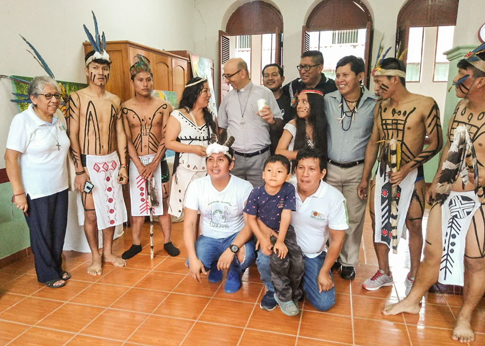 Dominican Sr. Zully Rojas Quispe, left, with some participants of the first art exhibition of the Etochime Harakbut group in Puerto Maldonado, Peru, in December 2020 (Courtesy of Zully Rojas Quispe)