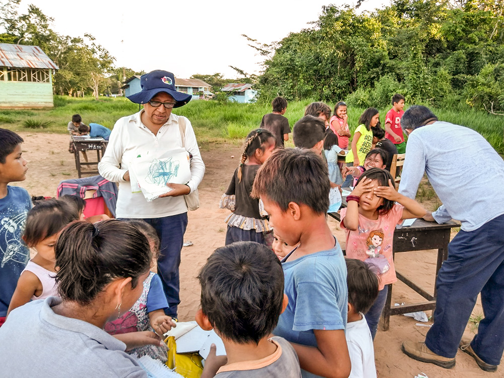 Dominican Sr. Zully Rojas Quispe takes part in an activity for children during one of her visits to the Indigenous communities of the Peruvian Amazon. (Courtesy of Zully Rojas Quispe)