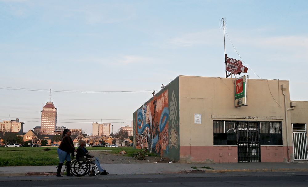 Shuttered storefronts line the area west of downtown Fresno, a city with a long history of redlining, or institutionalized housing racism. (Grist/Los Angeles Times via Getty Images/Luis Sinco)