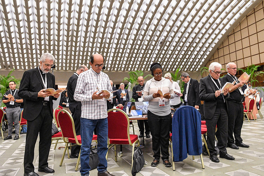 Members of the assembly of the Synod of Bishops gather for morning prayer Oct. 27, 2023, in the Paul VI Audience Hall at the Vatican. (CNS/Vatican Media)