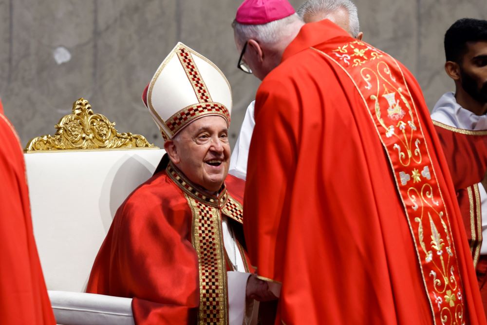 Pope Francis gives the pallium to Archbishop Christopher Coyne of Hartford, Connecticut, during Mass for the feast of Sts. Peter and Paul in St. Peter's Basilica at the Vatican June 29, 2024. 