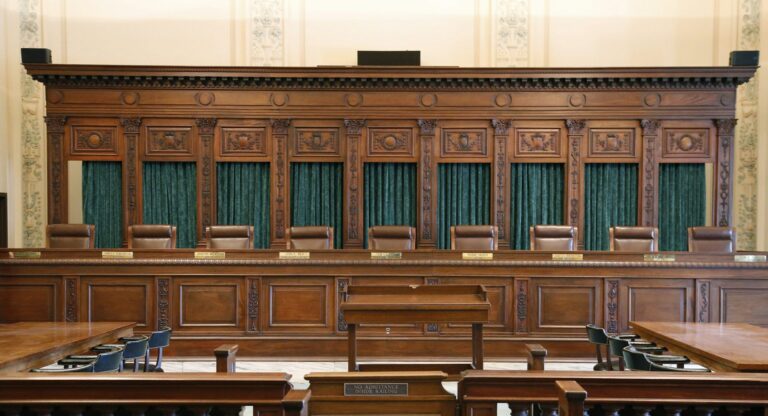 Paneled interior of courtroom.