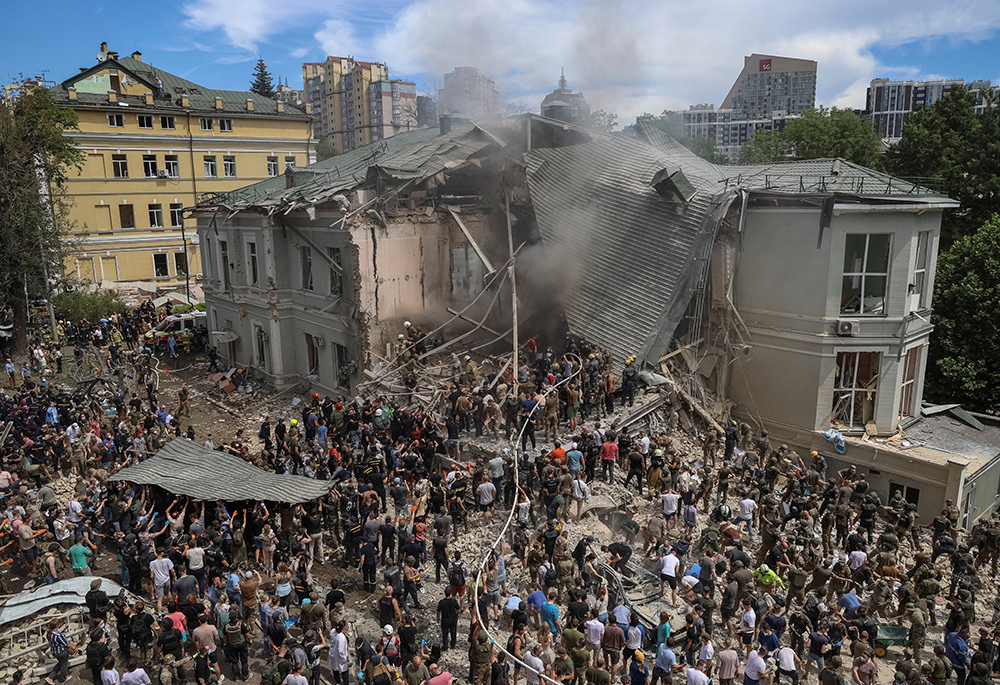 Rescuers work at Okhmatdyt Children's Hospital in Kyiv, Ukraine's capital, July 8, after it was severely damaged during Russian missile strikes amid Russia's war on Ukraine. At least 31 were killed and over 135 injured as Russian bombers pummeled Kyiv and numerous other cities throughout the nation that day with more than 40 missiles and guided aerial bombs, with one striking the large children's hospital. (OSV News/Reuters/Oleksandr Ratushniak)