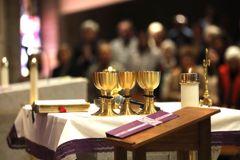 Communion chalices for reception of holy Communion by the faithful rest on the altar during Mass at Sacred Heart Church in Prescott, Arizona, Dec. 10, 2023. (OSV News/Bob Roller)