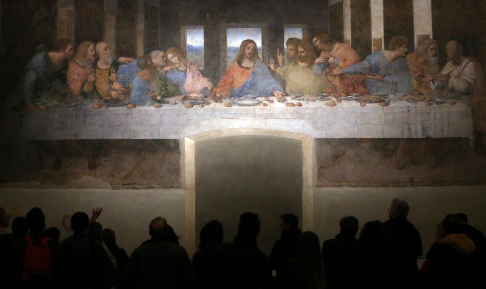 Visitors are pictured in a file photo looking at Leonardo da Vinci's "The Last Supper" on a refectory wall at Santa Maria delle Grazie Church in Milan. 