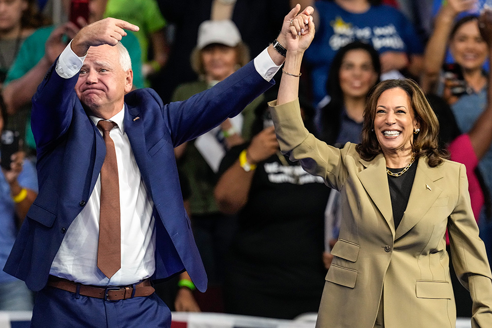 Democratic presidential nominee Vice President Kamala Harris and running mate Minnesota Gov. Tim Walz arrive at a campaign rally at Desert Diamond Arena Aug. 9 in Glendale, Arizona. (AP/Ross D. Franklin)