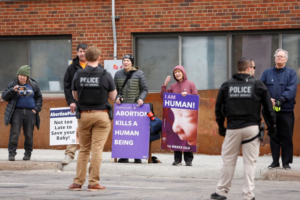 Abortion opponents demonstrate as U.S. Vice President Kamala Harris visits an abortion clinic in Minneapolis March 14. (OSV News/Reuters/Nicole Neri)