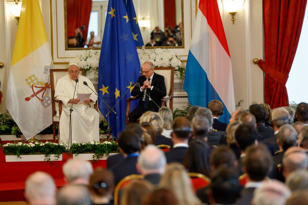 Pope Francis, seated next to Luxembourg's Prime Minister Luc Frieden, speaks to government authorities, members of the diplomatic corps and local representatives at the Cercle Cité in Luxembourg Sept. 26.  (CNS/Lola Gomez)