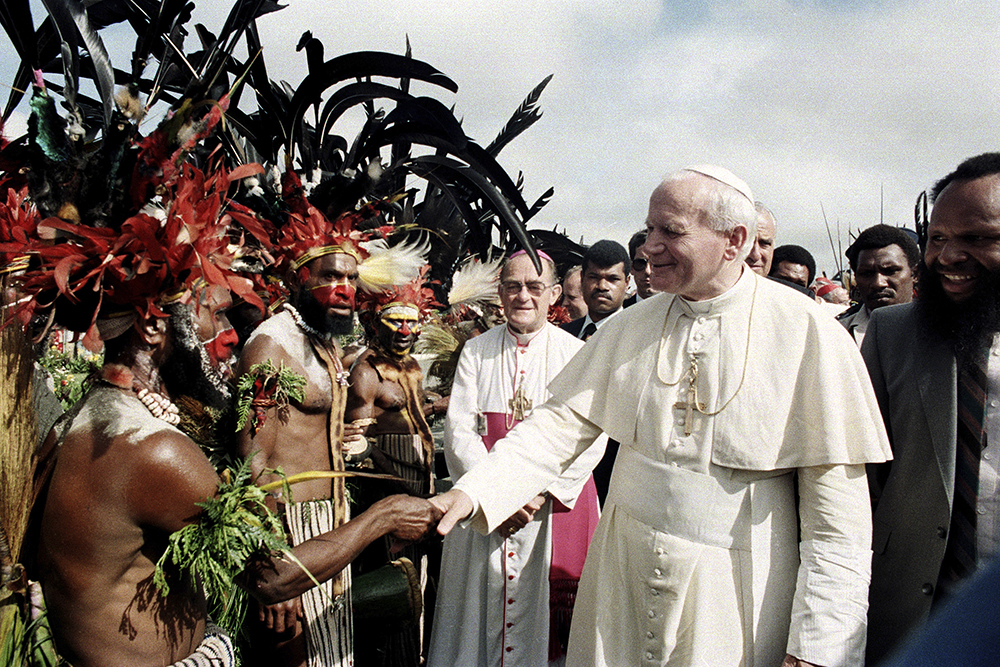 Pope John Paul II is greeted by Papua New Guinea Highland natives on his visit to Mt. Hagen, Papua New Guinea, on May 8, 1984. (AP file)