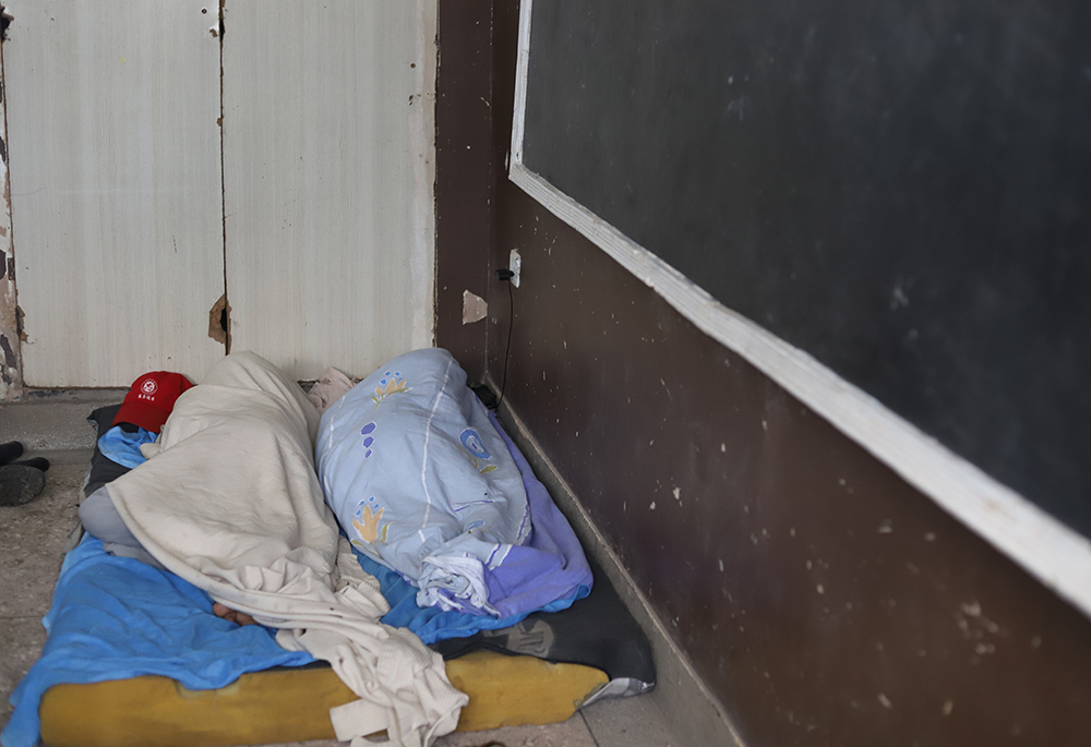 People displaced due to flooding sleep in a school classroom April 17 after their houses were flooded in Nairobi. (GSR photo/Doreen Ajiambo)