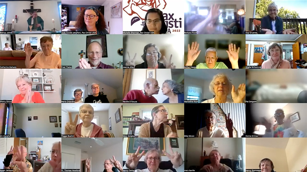 People exchange the sign of peace during a Mass celebrated Sept. 7 as part of Pax Christi USA's annual national conference, held virtually and attended by more than 200 Catholic peace and social justice advocates from across the country and the world. (NCR screenshot/YouTube/PaxChristUSA)