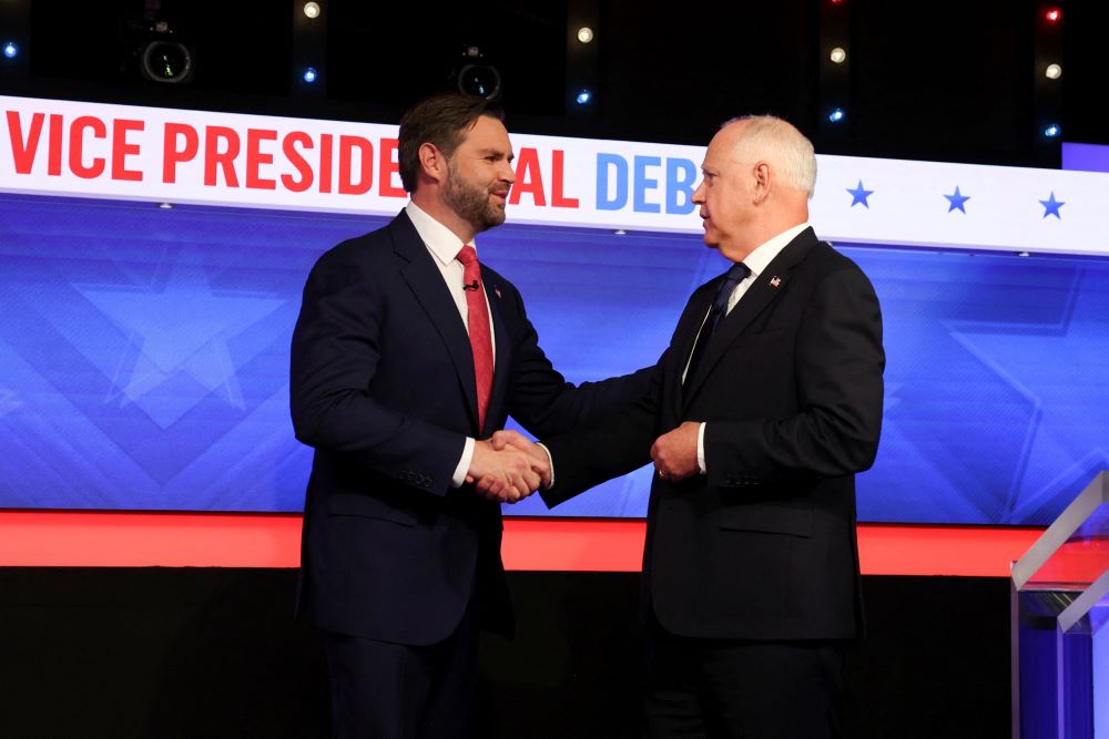 Republican vice presidential nominee Sen. JD Vance of Ohio and Minnesota Gov. Tim Walz, the Democratic vice presidential nominee, greet each other before taking part in their first and only debate at the CBS Broadcast Center in New York City Oct. 1. (OSV News/Reuters/Brendan McDermid)