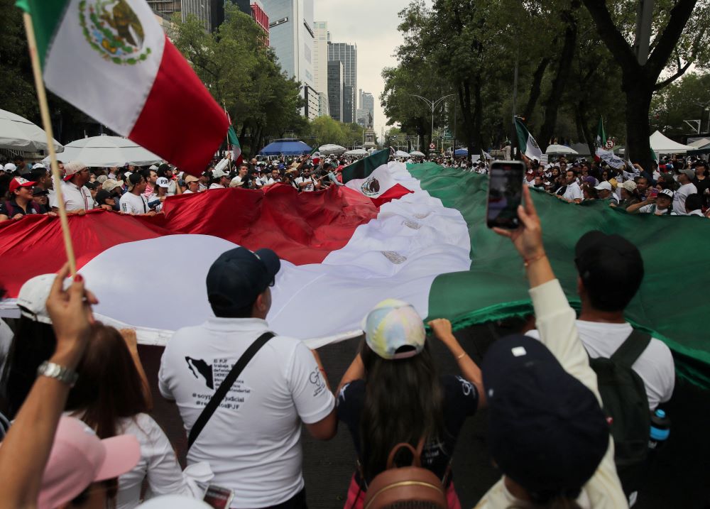 Protesters hold a flag outside the Senate building in Mexico City Sept. 5. 