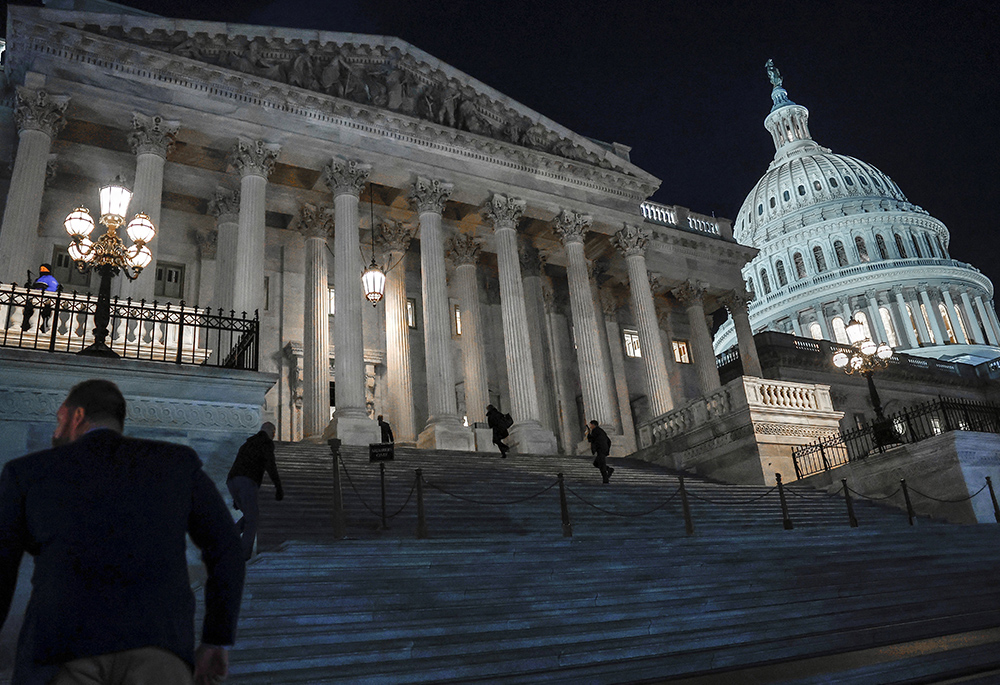 Members of the House of Representatives walk up the steps of the U.S. Capitol, Feb. 13 in Washington. (OSV News/Reuters/Evelyn Hockstein)