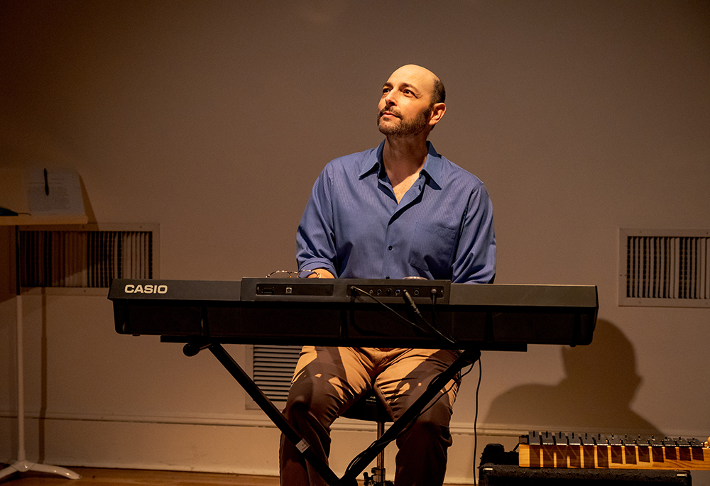 Matthew LaBanca, playing the piano in "Communion," said he thinks one of the reasons the show works well is that it is not preaching repudiation or "a reverse style of fire and brimstone against" the church. "It is a story of what happened through a human lens, through the lens of my experience — the humor and the nuance and the pain," he said. (Courtesy of Rebecca J. Michelson)