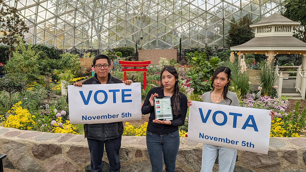 Jonas Reyes Jimenez, Mariana Cano Rodriguez and Nancy Martinez Hernandez stand inside one of the greenhouse domes in Mitchell Park in Milwaukee on Oct. 13. The students at Cristo Rey Jesuit High School sought to register voters for the 2024 election as part of an event in partnership with Catholic Climate Covenant. (Benjamin Rangel)