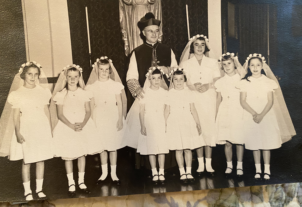 Bishop J. Carroll McCormick, center, officiated first holy Communion circa 1956 at Sacred Heart Academy in Philadelphia. Author Stephanie Mansfield is pictured third from left. (Courtesy of Stephanie Mansfield)