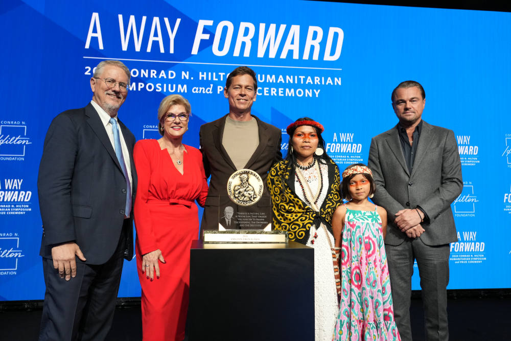 Peter Laugharn, president and CEO, Conrad N. Hilton Foundation, from left, Linda Hilton, chair of the board, Conrad N. Hilton Foundation, Mitch Anderson, executive director and co-founder, Amazon Frontlines, Nemonte Nenquimo, co-founder, Amazon Frontlines, Daime and  actor and environmentalist Leonardo DiCaprio at the 2024 Hilton Humanitarian Prize Ceremony honoring Amazon Frontlines at The Beverly Hilton, Wednesday, Oct. 9, 2024 in Beverly Hills, Calif. (Jordan Strauss/AP Content Services for Conrad N. Hil