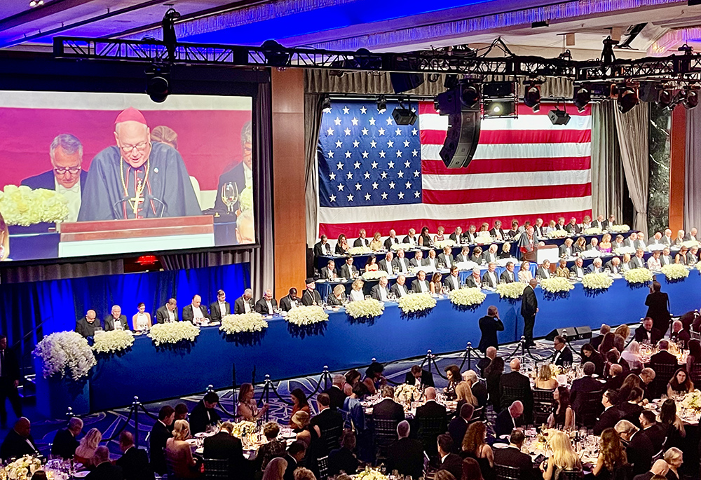 New York Cardinal Timothy Dolan leads a prayer at the  Alfred E. Smith Memorial Foundation Dinner Oct. 17, the fundraiser for Catholic charities in New York at the New York Hilton Midtown. (NCR photo/Camilllo Barone)