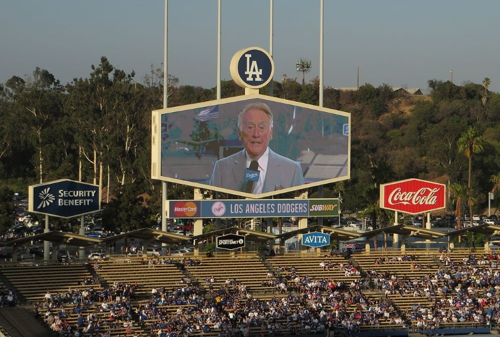 Longtime LA Dodgers announcer Vin Scully appears on a screen June 26, 2014, as the Dodgers took on the St. Louis Cardinals at Dodger Stadium. 