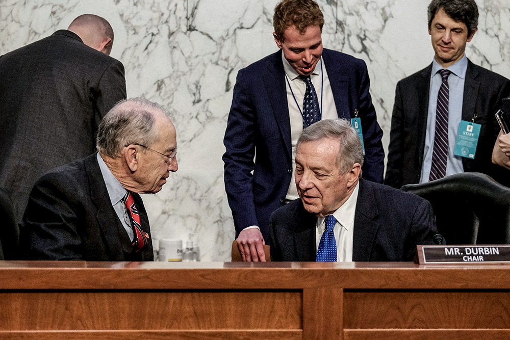 Sen. Chuck Grassley, R-Iowa, left, speaks with Sen. Dick Durbin, D-Ill., before a U.S. Senate Judiciary Committee business meeting to vote on U.S. Supreme Court nominee Judge Ketanji Brown Jackson on Capitol Hill in Washington April 4, 2022. (CNS/Reuters/Michael A McCoy)