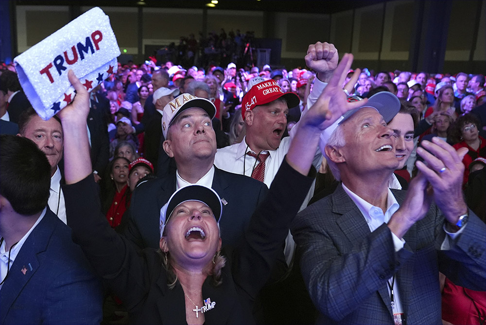 Supporters watch returns at a campaign election night watch party for Republican presidential nominee former President Donald Trump at the Palm Beach Convention Center Nov. 6 in West Palm Beach, Fla. (AP/Evan Vucci)