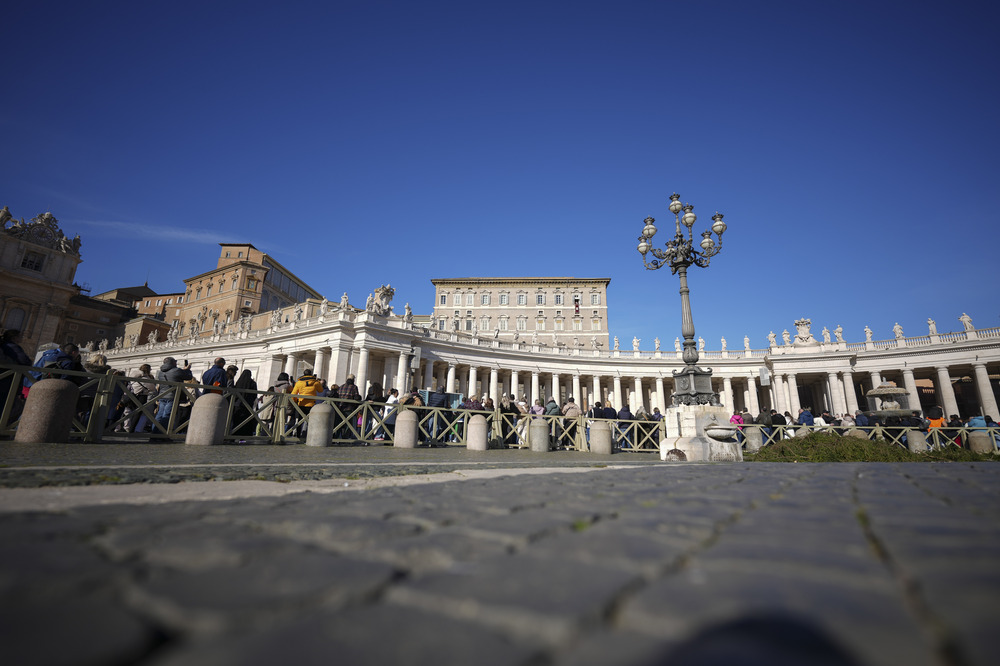 View looking up at colonnade of St. Peter's Square. 