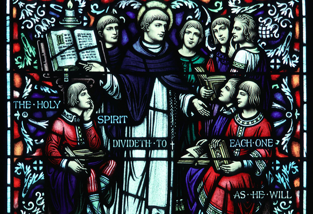 St. Thomas Aquinas is depicted with students in a window at St. Peter's Church in St. Peter, Minnesota. He wrote Summa Theologiae and articulated a theological synthesis that would influence Western Christian thought for centuries. (CNS/Crosiers)