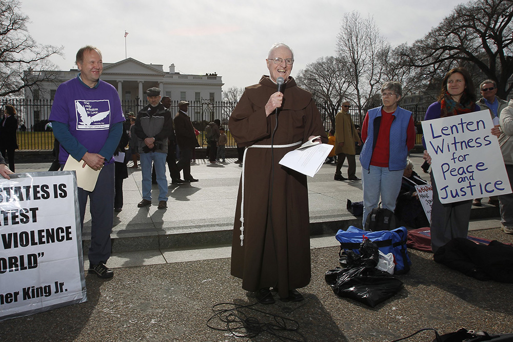 Franciscan Fr. Joseph Nangle, associate pastor of Our Lady Queen of Peace in Arlington, Va., speaks during a prayer service in front of the White House in Washington on Ash Wednesday, Feb. 22, 2012. (CNS/Peter Lockley)