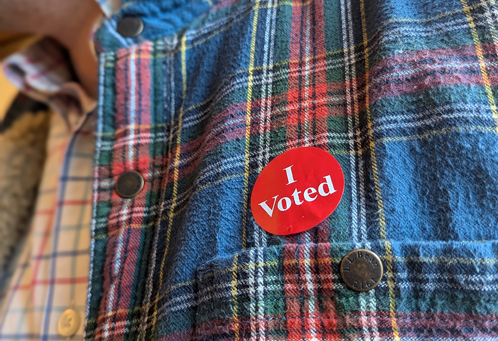 A Minnesota voter wears his "I Voted" sticker after casting an early ballot in St. Paul Nov. 1, 2024. National Catholic Reporter named the Catholic voter its Newsmaker of the Year. (OSV News/Maria Wiering)