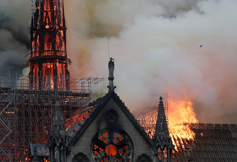 Flames and smoke billow from Notre Dame Cathedral in Paris, on April 15, 2019. (OSV News/Reuters/Benoit Tessier)