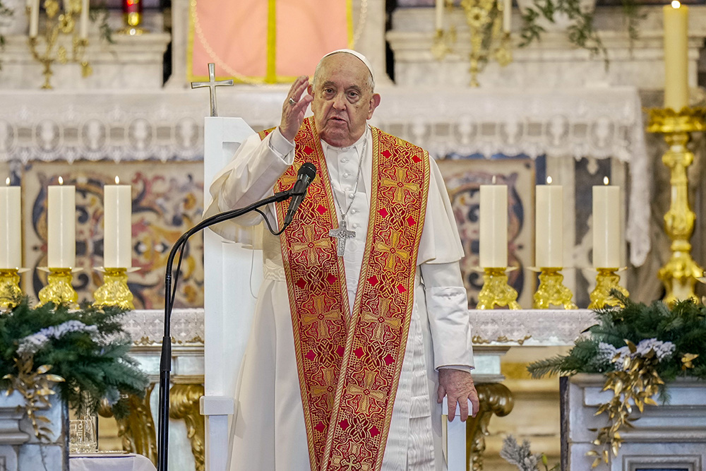 Pope Francis gives his blessing after praying the Angelus with local bishops, priests, deacons, consecrated persons and seminarians at the Cathedral of Our Lady of the Assumption in Ajaccio, France, Dec. 15. (CNS/Lola Gomez)