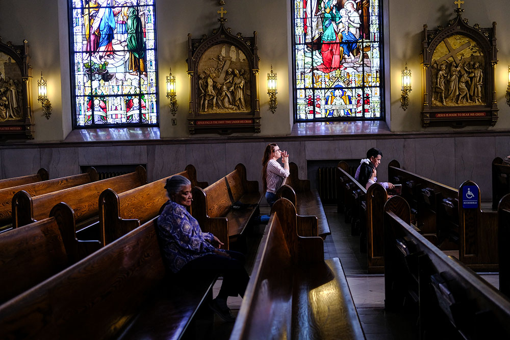 A parishioner prays at St. Peter the Apostle Catholic Church in Reading, Pa., on June 16, 2024. The Reading Eagle reported in November that Trump captured nearly 35% of the vote in the city, which is 67% Latino. A majority of Hispanic Catholics voted for Kamala Harris, but Latinos are part of the story of how a shift in the Catholic vote contributed to Trump's win. (AP/Luis Andres Henao)