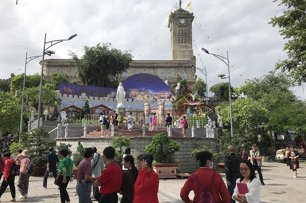 Tourists visit a big creche outside the Christ the King Cathedral in Nha Trang, central Vietnam on Dec. 20. (Joachim Pham)