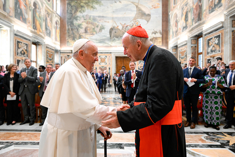 Pope Francis greets Cardinal Christoph Schönborn of Vienna, one of the honorary patrons of the International Catholic Legislators Network, during an audience with network members at the Vatican Aug. 26, 2023. (CNS/Vatican Media)