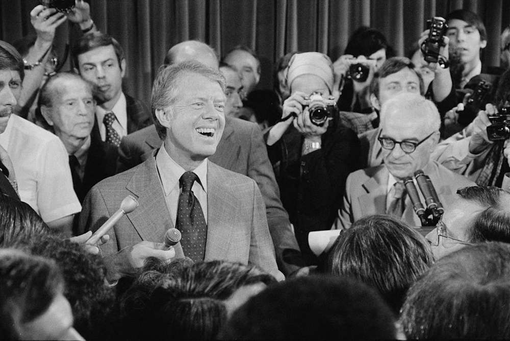 President Jimmy Carter attends a press conference, surrounded by journalists, June 13, 1977. (Library of Congress/Thomas J. O'Halloran/Handout via Reuters/file photo)