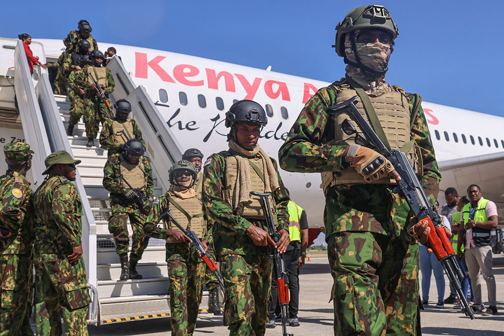 Kenyan police officers disembark from a plane while arriving as part of the Multinational Security Support Mission in Haiti, at the Toussaint Louverture International Airport in Port-au-Prince, Haiti, Jan. 18, 2025. (Reuters/Ralph Tedy Erol)