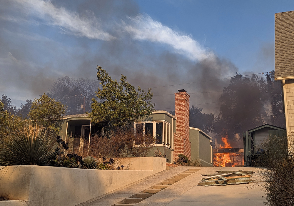 On Jan. 8, Nick and Timithie Norman slipped by police lines and roadblocks to drive to their home to find out if it was still standing and grab a few sentimental items. As they drove up, they found their home was the western-most structure left in the Altadena neighborhood. (Nick Norman)