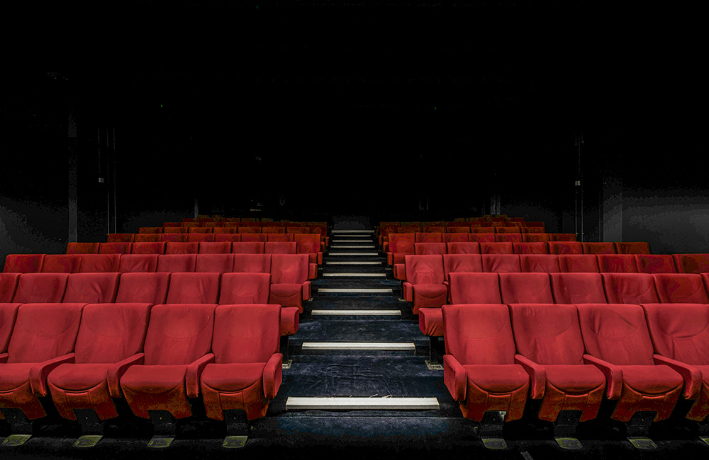 Seats in a movie theater (Unsplash/Felix Mooneeram)