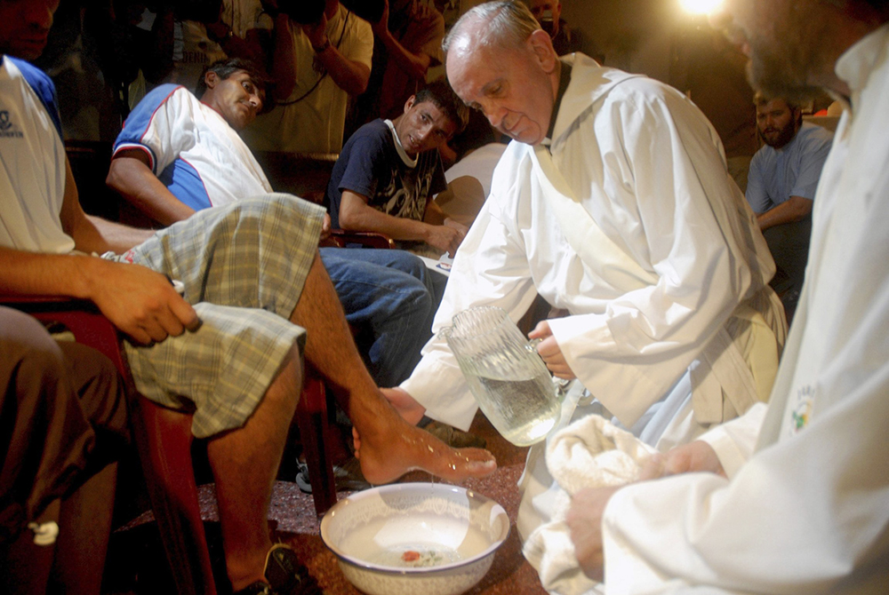 Argentine Cardinal Jorge Mario Bergoglio, now Pope Francis, washes the feet of residents of a shelter for drug users during Holy Thursday Mass in 2008 at a church in a poor neighborhood of Buenos Aires, Argentina. (CNS/Reuters/Enrique Garcia Medina)