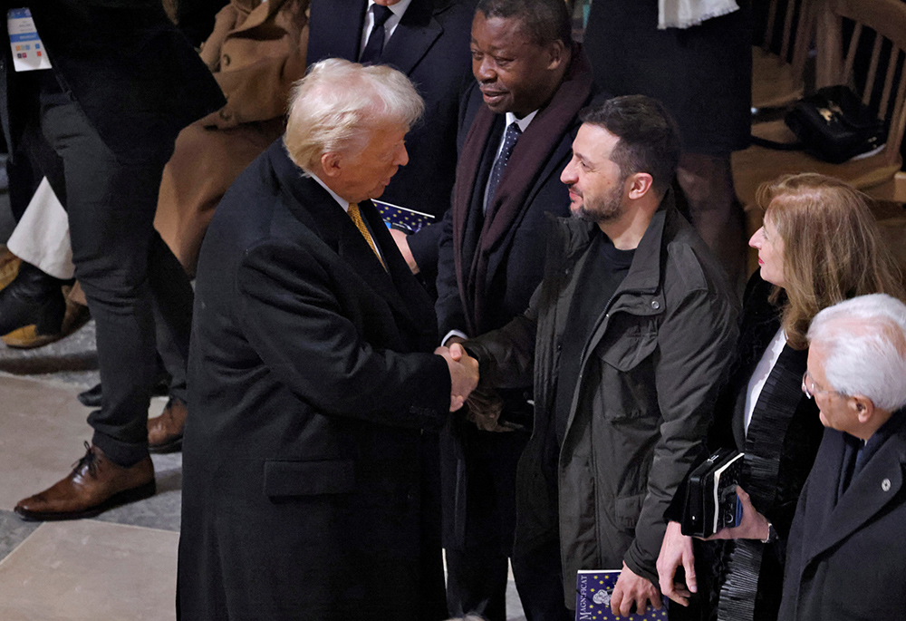 U.S. President-elect Donald Trump and Ukrainian President Volodymyr Zelenskyy shake hands inside Notre Dame Cathedral ahead of a ceremony to mark its re-opening following the 2019 fire, in Paris, Dec. 7, 2024. (OSV News/Ludovic Marin/pool via Reuters)