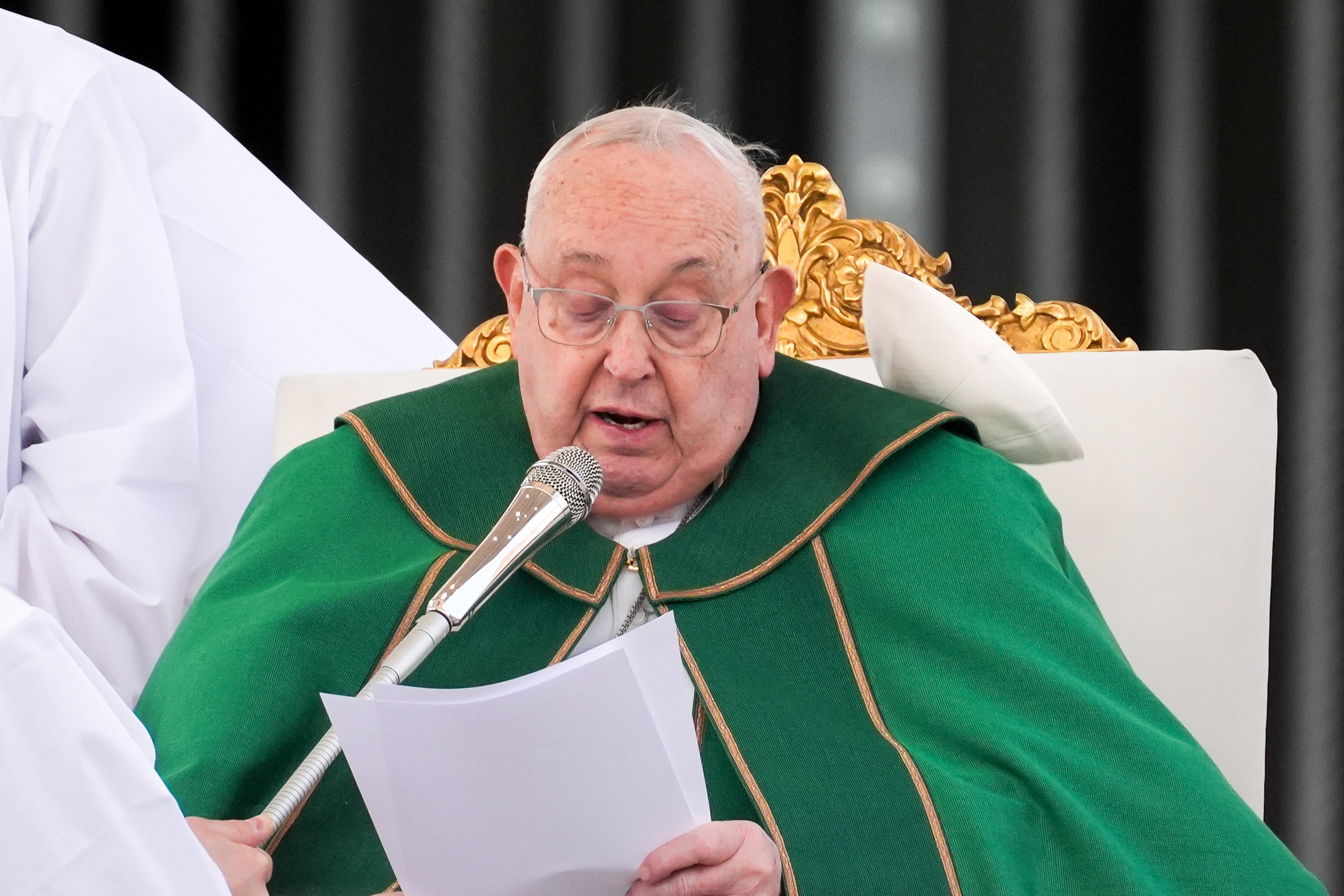 As Pope Francis prays the Angelus at the conclusion of Mass for the Jubilee of the Armed Services, Police and Security Personnel in St. Peter’s Square at the Vatican Feb. 9, 2025, a strong gust of wind blows his zucchetto off his head. (CNS photo/Lola Gomez)