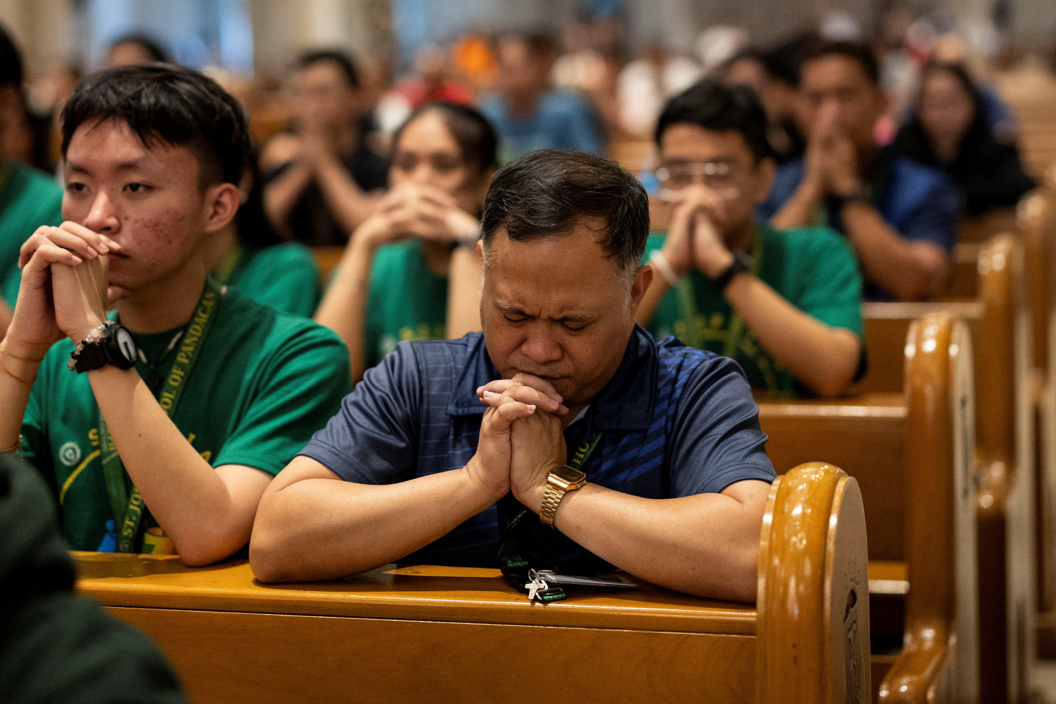 Filipino Catholics attend a Holy Hour to pray for Pope Francis' health, at the Manila Cathedral Feb. 21, 2025.