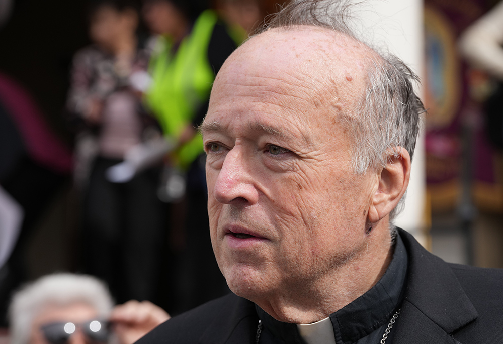 San Diego Cardinal Robert McElroy speaks to reporters prior to a prayer service for immigrants at St. Joseph Cathedral, Feb. 9 in San Diego. (NCR photo/Chris Stone)